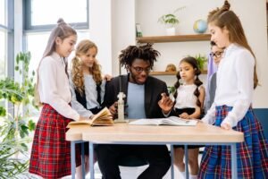 a male professor teaching his students